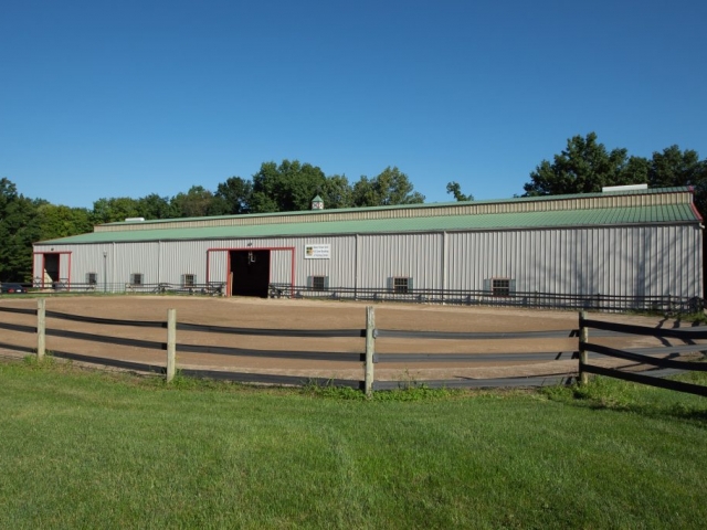 Steel barn structure with a 160' X95' outdoor arena
